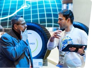 Two people talking at Goodyear CES booth