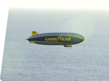 Blimp Flying Over Water