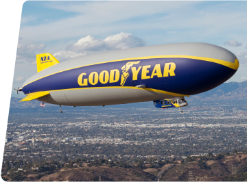 Goodyear Blimp Flying Over Land