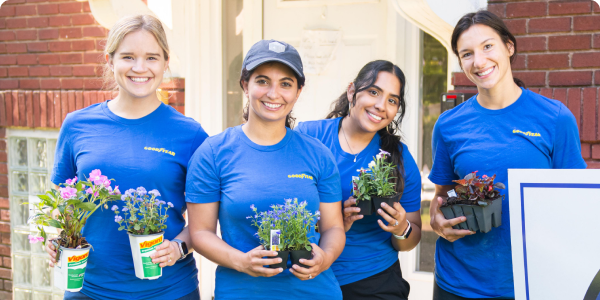 Volunteers Holding Flowers