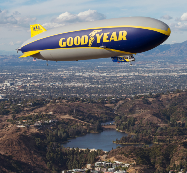 Goodyear Blimp flying over the earth