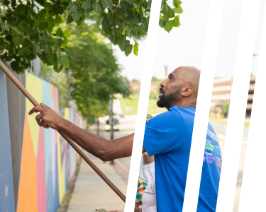 man painting wall