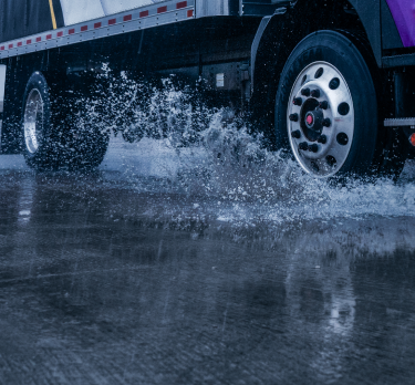 Gatik branded truck with purple accents