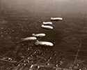 Goodyear's original Akron-based blimp fleet launched from Wingfoot Lake on Nov. 4, 1930, and flew in formation over Akron and the Goodyear Airdock. The aerial blimp parade included the Pilgrim, Neponset, Vigilant, Mayflower, Defender and Puritan.