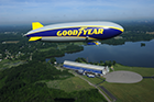 Wingfoot One, The Goodyear Tire & Rubber Company's newest blimp, flies over the company's airship hangar at Wingfoot Lake in Suffield, Ohio.