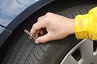 During routine tire maintenance, the remaining tread depth should be checked.