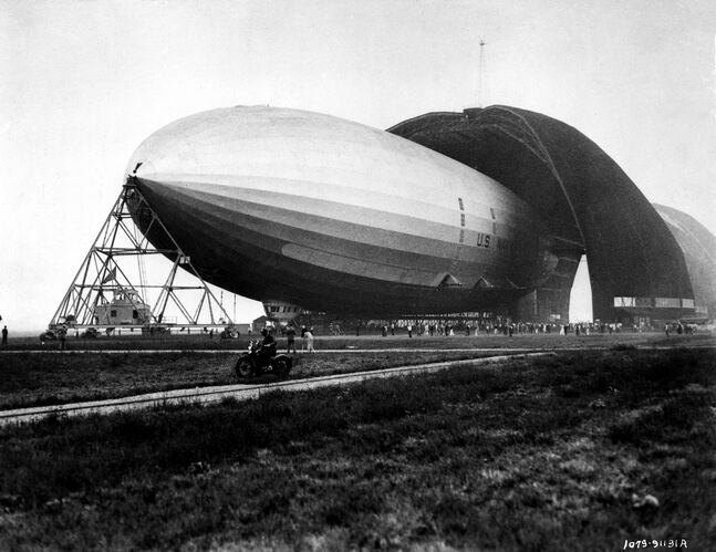 Sexy gal with great zeppelins takes a shower.